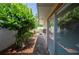 Private patio with brick flooring, lush greenery, and comfortable seating area at 2202 Starboard, Winter Haven, FL 33881