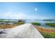 Picturesque waterfront view featuring a private dock and boat house on a serene lake at 2202 Starboard, Winter Haven, FL 33881