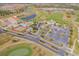 Aerial view of Providence showcasing the golf course, tennis courts, pool, and well-maintained community at 2340 Pinehurst Ct, Davenport, FL 33837