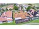 Aerial view showing the roof and screened in patio at 2340 Pinehurst Ct, Davenport, FL 33837