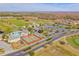 Providence aerial view featuring a golf course, community center, pool, tennis courts, and picturesque homes at 2340 Pinehurst Ct, Davenport, FL 33837
