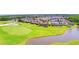 Aerial view of the community and golf course, highlighting the manicured greenways and water features at 2340 Pinehurst Ct, Davenport, FL 33837