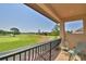 Enjoy golf course views from this balcony with its wrought iron railing and comfortable seating at 2340 Pinehurst Ct, Davenport, FL 33837