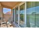 Enjoy views of golf course from this home's balcony, featuring tiled flooring and comfortable seating at 2340 Pinehurst Ct, Davenport, FL 33837