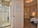Bathroom with modern glass shower and adjacent room at 2340 Pinehurst Ct, Davenport, FL 33837