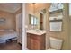 Bathroom featuring a vanity, mirror, and toilet with bedroom access at 2340 Pinehurst Ct, Davenport, FL 33837