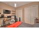 Bedroom featuring wood flooring, closet, and a desk space for functional use at 2340 Pinehurst Ct, Davenport, FL 33837