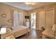 Comfortable bedroom with a desk and a view into an ensuite bathroom at 2340 Pinehurst Ct, Davenport, FL 33837