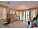 Bedroom with a closet, and french doors leading to a balcony with view of trees and bodies of water at 2340 Pinehurst Ct, Davenport, FL 33837