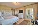 Bedroom featuring work space and sliding glass door with view of outdoor seating at 2340 Pinehurst Ct, Davenport, FL 33837