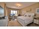 Bedroom with a workspace, white furniture, and plush carpet at 2340 Pinehurst Ct, Davenport, FL 33837