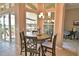 Cozy dining area with natural light and an inviting atmosphere, perfect for Gathering meals and entertaining at 2340 Pinehurst Ct, Davenport, FL 33837