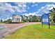 Inviting entrance to Providence Golf Club community with lush landscaping and attractive signage at 2340 Pinehurst Ct, Davenport, FL 33837