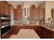 This kitchen showcases granite countertops, stainless steel appliances, a central island, and stylish backsplash at 2340 Pinehurst Ct, Davenport, FL 33837