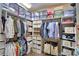 Organized walk-in closet with ample shelving and storage, providing efficient space for clothes and accessories at 2340 Pinehurst Ct, Davenport, FL 33837