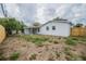 Backyard view of the house features large yard and fenced property line at 2409 E Civitan Ave, Lakeland, FL 33801