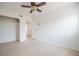 Cozy bedroom with ceiling fan, closet space, and access to an ensuite bathroom at 2409 E Civitan Ave, Lakeland, FL 33801