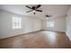 Large living room with new vinyl plank floors, ceiling fans and natural lighting at 2409 E Civitan Ave, Lakeland, FL 33801