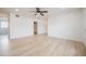 Open living room with hardwood flooring, neutral color scheme, and ceiling fan at 2409 E Civitan Ave, Lakeland, FL 33801
