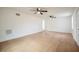 Expansive living room boasts new vinyl plank floors, ceiling fans and bright lighting at 2409 E Civitan Ave, Lakeland, FL 33801