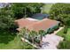 Aerial view of a charming property showcasing a pool, lush greenery and beautiful landscaping at 255 Lake Link Rd, Winter Haven, FL 33884