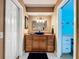 Bathroom showing vanity with drawers, mirror, lighting and doorway to toilet and shower at 255 Lake Link Rd, Winter Haven, FL 33884