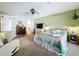 Relaxing bedroom with ceiling fan, closet with sliding door, carpet flooring and ensuite bathroom at 255 Lake Link Rd, Winter Haven, FL 33884