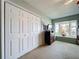 Bedroom with a large closet, bay window with view, dresser and TV at 255 Lake Link Rd, Winter Haven, FL 33884