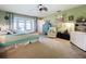 Spacious bedroom with a ceiling fan and French doors that lead to the outdoor patio area at 255 Lake Link Rd, Winter Haven, FL 33884