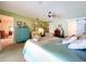 Large bedroom features neutral carpet, ceiling fan, comfortable chair and a large storage closet at 255 Lake Link Rd, Winter Haven, FL 33884