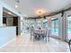 Dining room with neutral colors, lots of natural light, and connection to the Kitchen and outdoor spaces at 255 Lake Link Rd, Winter Haven, FL 33884