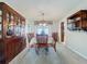 Bright dining room with wooden furniture, a china cabinet, and natural light at 255 Lake Link Rd, Winter Haven, FL 33884