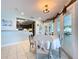 Charming dining area showcasing a view into the updated kitchen and out to the backyard via large glass doors at 255 Lake Link Rd, Winter Haven, FL 33884