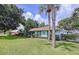 Beautiful one-story home boasts lush green grass and landscaping at 255 Lake Link Rd, Winter Haven, FL 33884