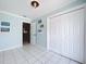 Hallway with tiled flooring, closet and doors, providing convenient access to other areas of the home at 255 Lake Link Rd, Winter Haven, FL 33884