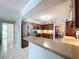 Open concept kitchen with stainless steel appliances, ample counter space, and seamless transition to the dining area at 255 Lake Link Rd, Winter Haven, FL 33884