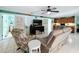 Comfortable living room boasting coastal decor, built-in cabinets, and an airy atmosphere with natural light at 255 Lake Link Rd, Winter Haven, FL 33884
