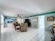 Open-concept living area with tiled floors, cozy seating, and easy access to other living spaces in the home at 255 Lake Link Rd, Winter Haven, FL 33884