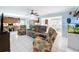 Spacious living room showcasing an open floor plan, plush seating, and connectivity to the kitchen and dining spaces at 255 Lake Link Rd, Winter Haven, FL 33884