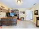 Spacious home office with decorative desk, shelving, and adjacent doorway leading to other rooms at 255 Lake Link Rd, Winter Haven, FL 33884