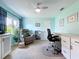 Home office featuring a comfortable recliner, built-in desk, and ample natural light at 255 Lake Link Rd, Winter Haven, FL 33884