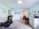 Spacious office with dual built-in desks, ceiling fan and light blue colored walls at 255 Lake Link Rd, Winter Haven, FL 33884
