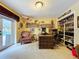 Home office with decorative desk, shelving, and comfortable seating, perfect for a productive workspace at 255 Lake Link Rd, Winter Haven, FL 33884
