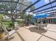 A screened-in patio featuring multiple seating areas at 255 Lake Link Rd, Winter Haven, FL 33884
