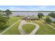 Beautiful lakefront home with a circular driveway and well-maintained lawn at 2731 State Road 557, Lake Alfred, FL 33850