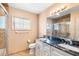 Well-lit bathroom features a double vanity, a walk-in shower and tile flooring at 2731 State Road 557, Lake Alfred, FL 33850