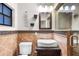 Bathroom featuring a modern sink, toilet, tiled walls, and glass-enclosed shower at 2731 State Road 557, Lake Alfred, FL 33850