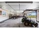 Large garage area with ample space for vehicles and equipment and lake view at 2731 State Road 557, Lake Alfred, FL 33850