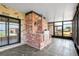 Enclosed patio features brick pizza oven with tiled floors and a scenic backyard view at 2731 State Road 557, Lake Alfred, FL 33850