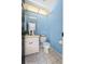 Charming bathroom with a unique vanity, toilet, and coordinated accessories at 2987 Plantation Rd, Winter Haven, FL 33884